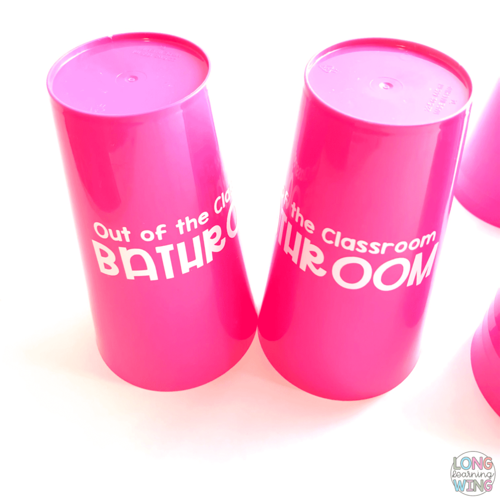 two cups with vinyl lettering using silhouette cutter