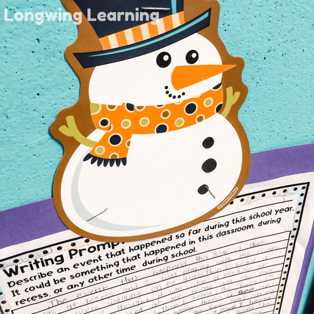 snowman cutout holding student work