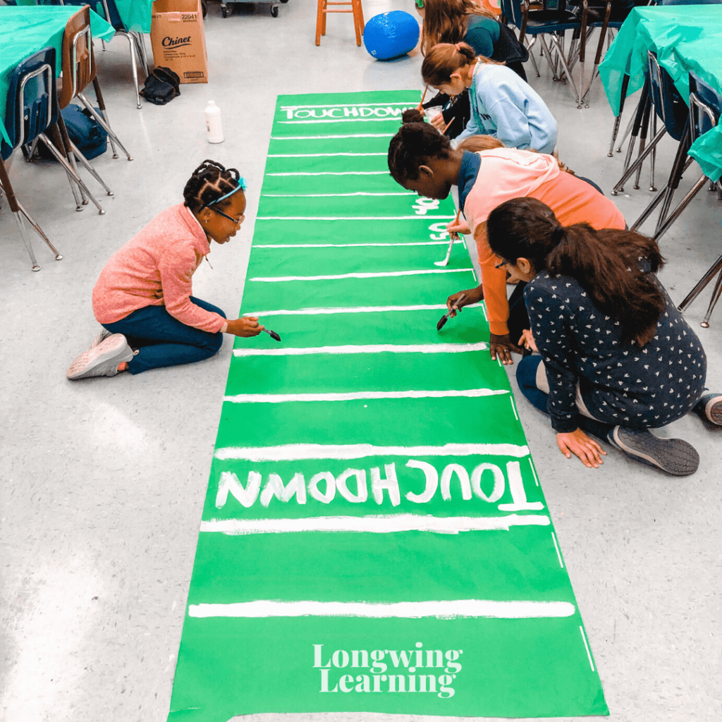 kids painting a football field